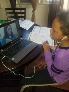 Student video chatting with teacher for distance learning
