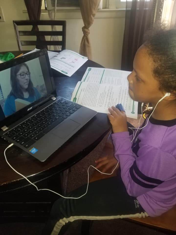 Student video chatting with teacher for distance learning