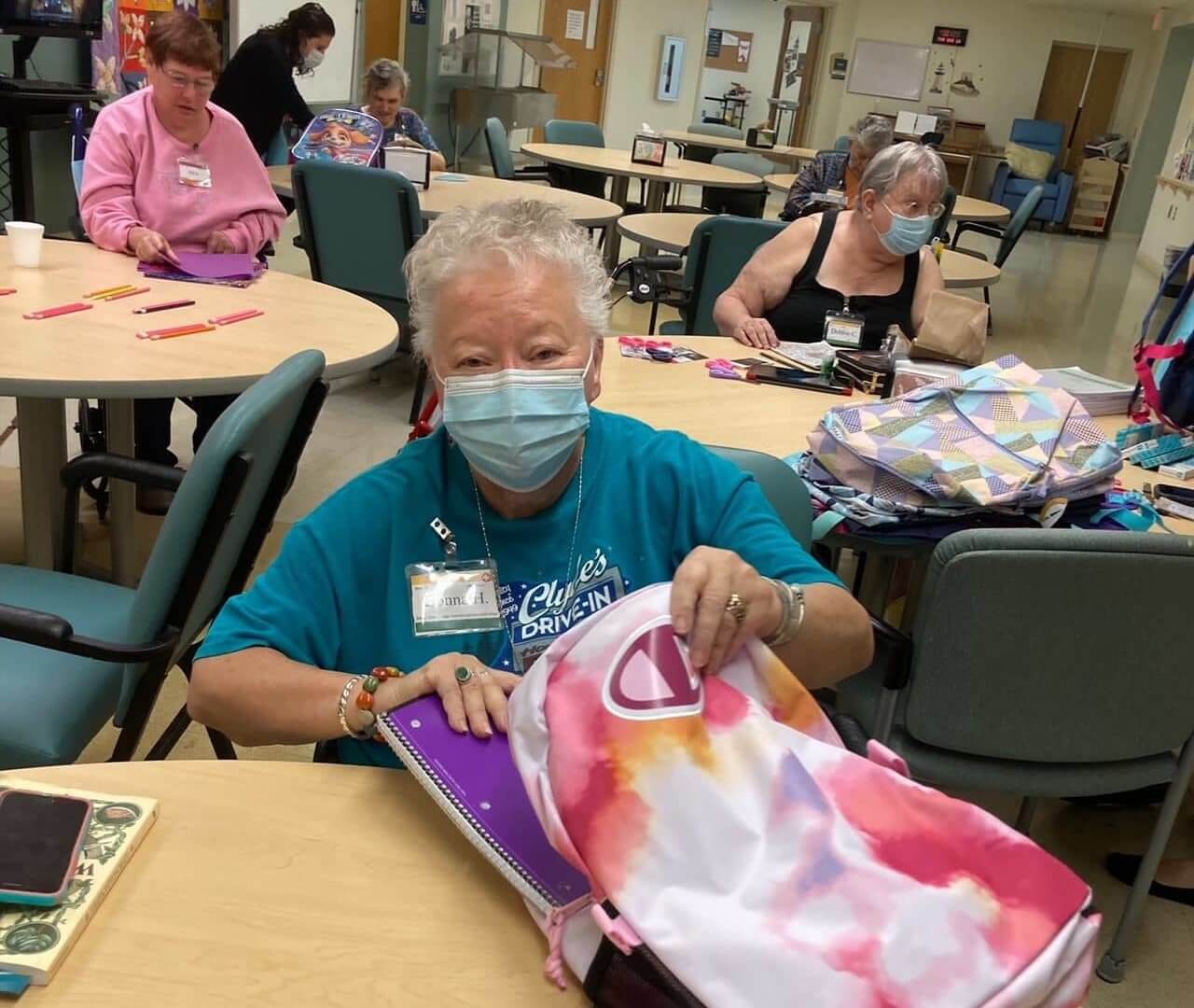 Lady Stuffs Backpack with Supplies