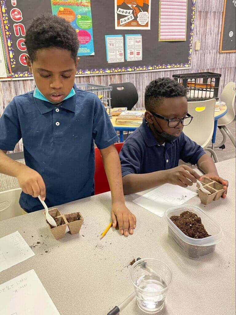 BHCSA Students get in touch with nature in a science project.