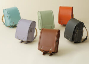 A Picture of 6 different randoserus, or stiff-sided backpacks that are a custom in Japanese Educational traditions